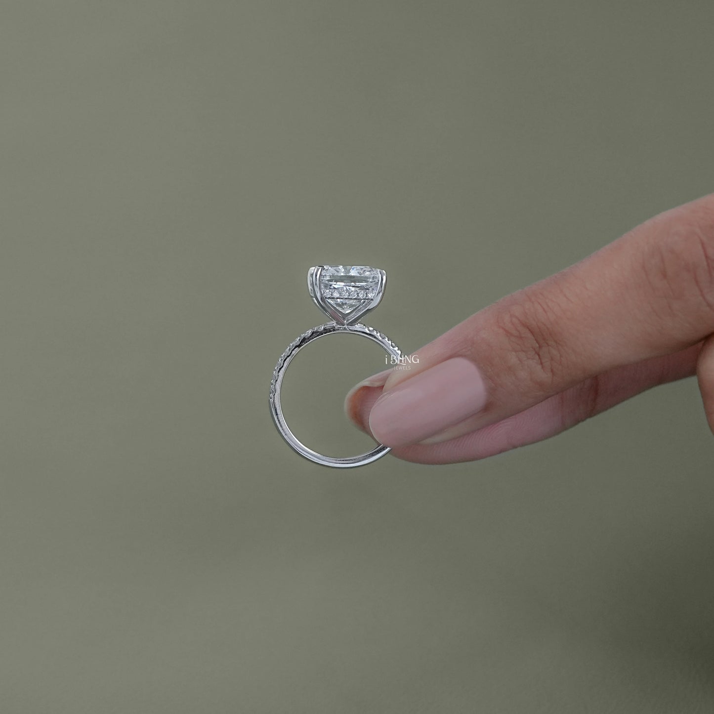 Top view cushion cut lab grown diamond ring highlighting halo accent