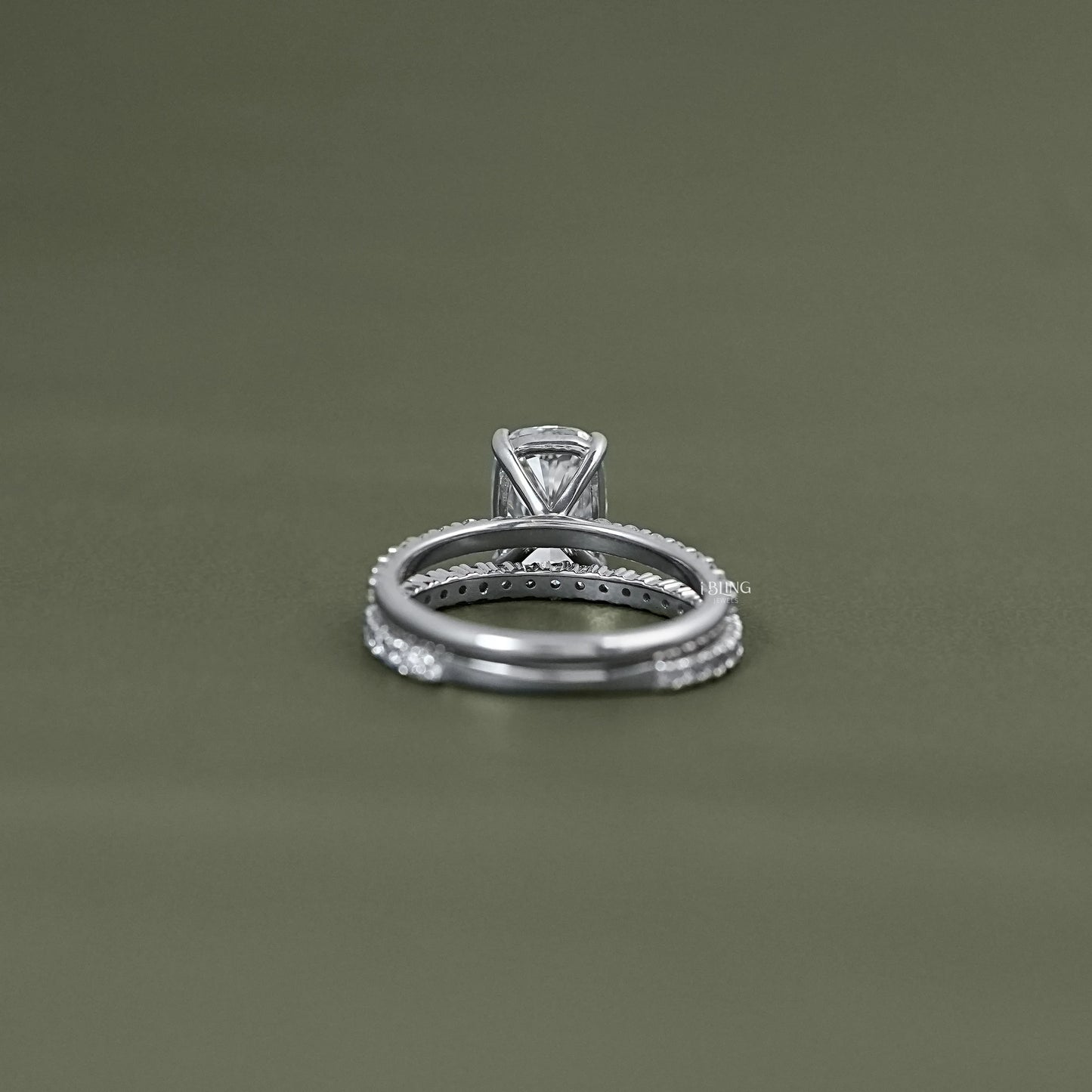 Back view of cushion cut bridal set showing polished white gold bands