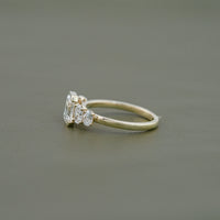 Half Bezel Set Emerald And Oval Five Stone Engagement Ring