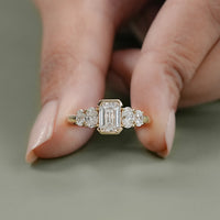 Half Bezel Set Emerald And Oval Five Stone Engagement Ring