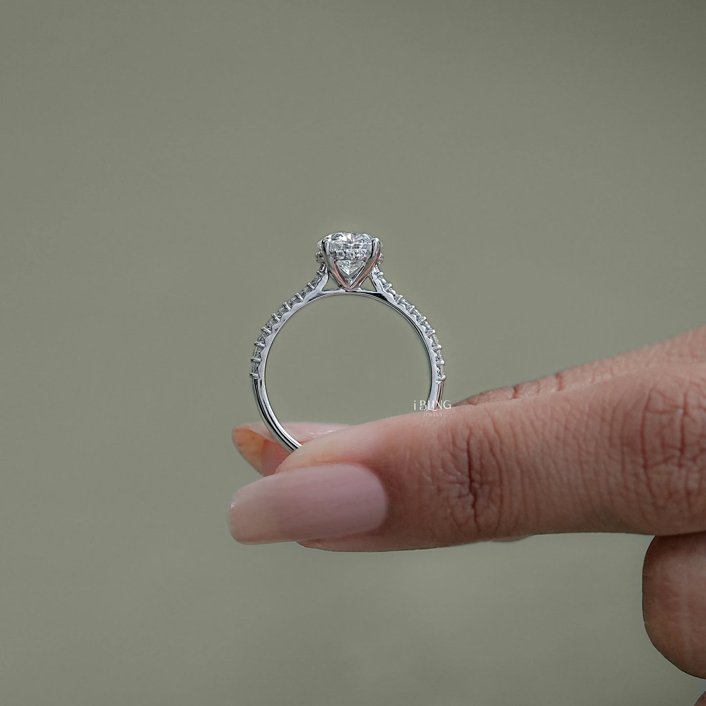Top view diamond accent ring featuring oval lab diamond hidden halo layout