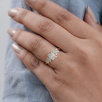 Half Bezel Set Emerald And Oval Five Stone Engagement Ring