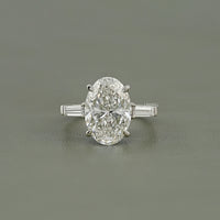 Oval And Tappered Baguette Cut Three Stone Ring