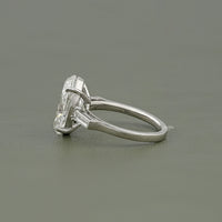 Oval And Tappered Baguette Cut Three Stone Ring