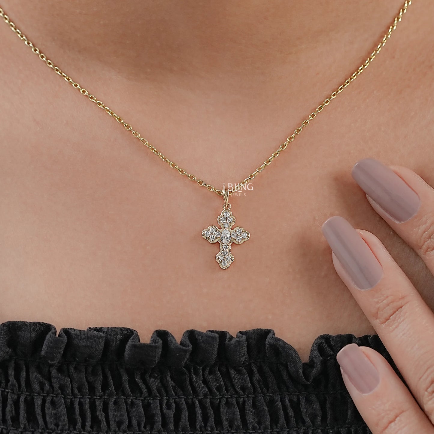 Top view silver and diamond cross pendant crafted with pear cut stone