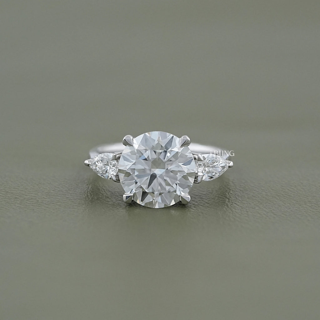Round Cut Diamond Three Stone Ring With Pear Side Stones