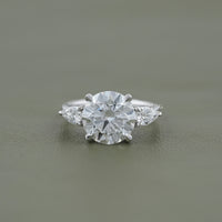 Round Cut Diamond Three Stone Ring With Pear Side Stones
