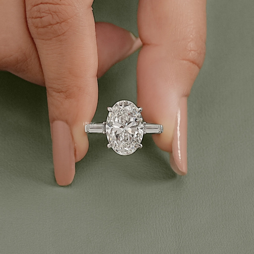 Oval And Tappered Baguette Cut Three Stone Ring