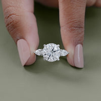 Round Cut Diamond Three Stone Ring With Pear Side Stones