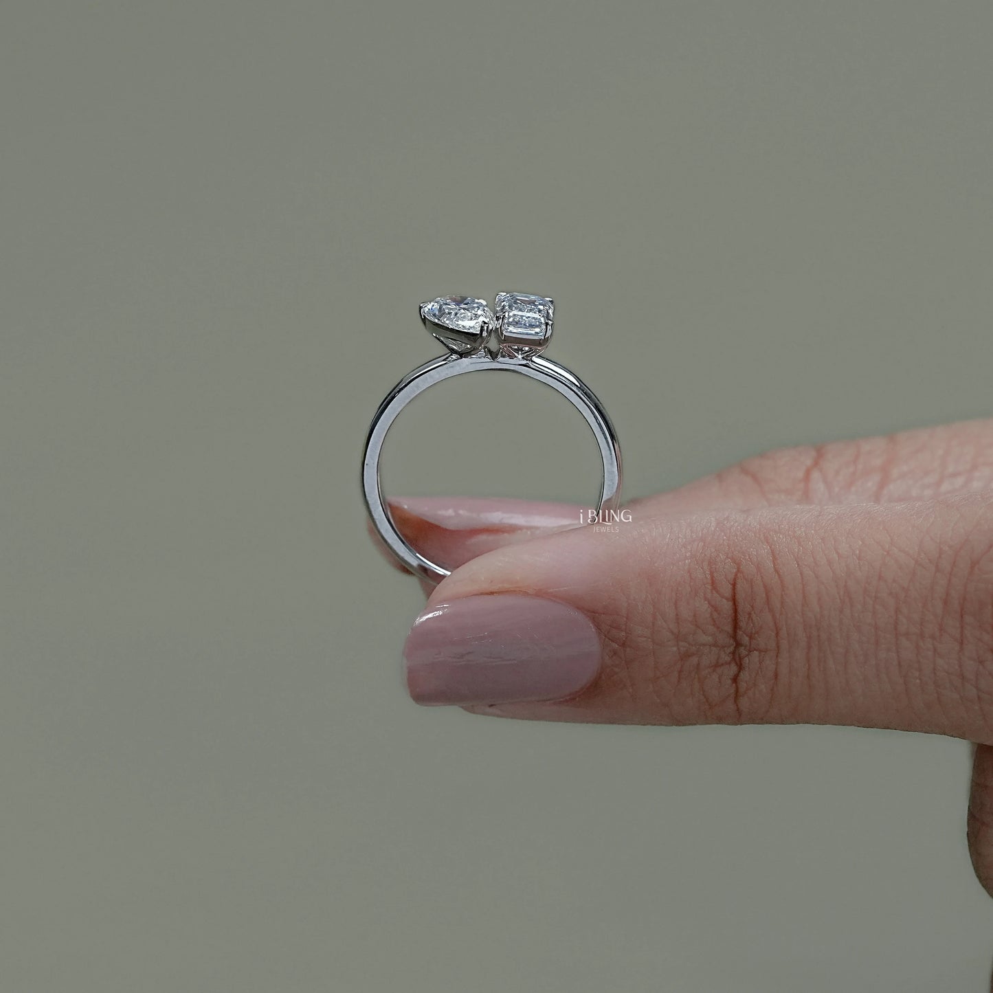 Top view toi et moi custom ring designed with pear and emerald diamonds