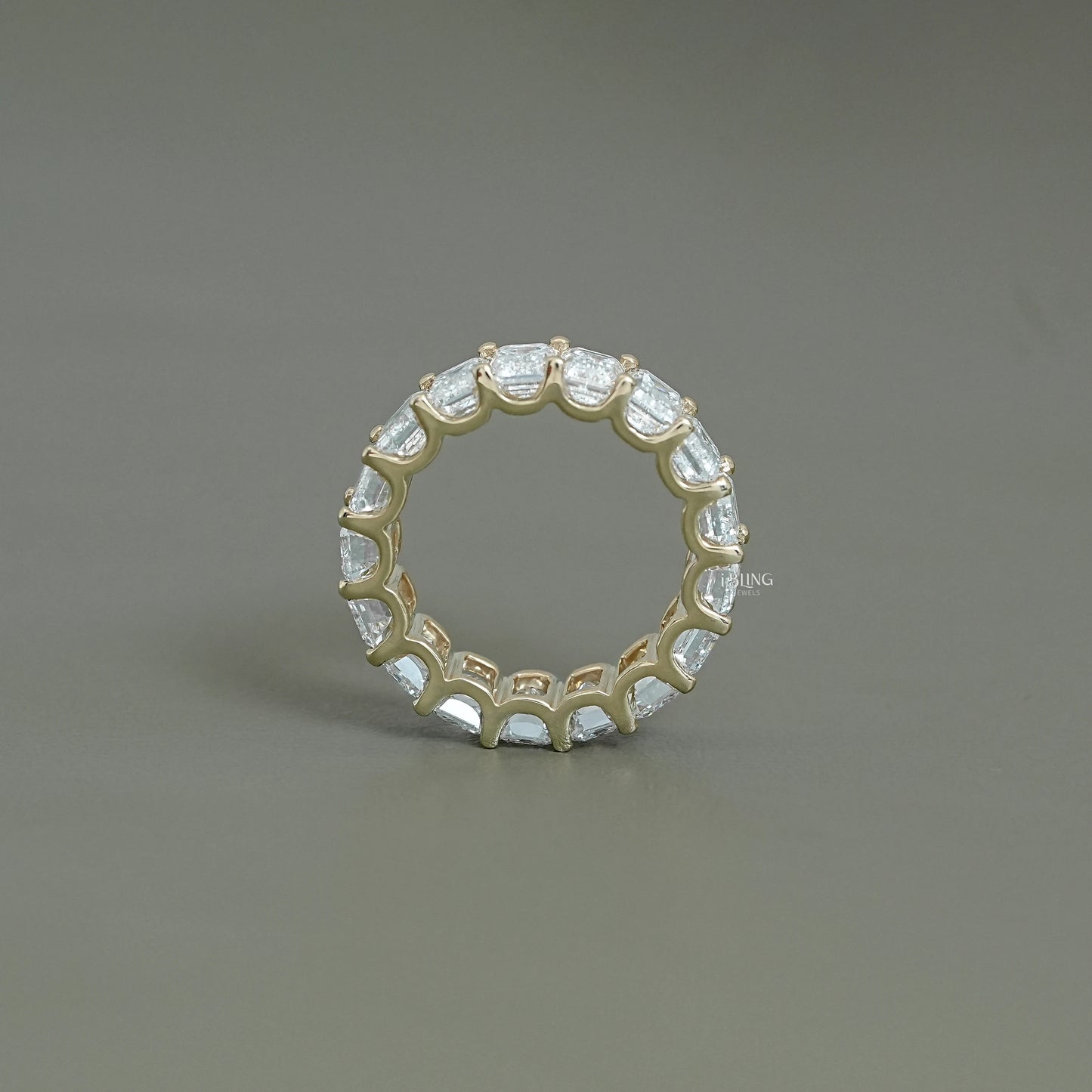 Top-down circular view of emerald eternity band showing endless design of the full diamond pavé