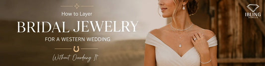 Bride wearing an off-shoulder wedding dress and layered pear diamond necklace with tennis necklace, drop earrings, and a tennis bracelet.