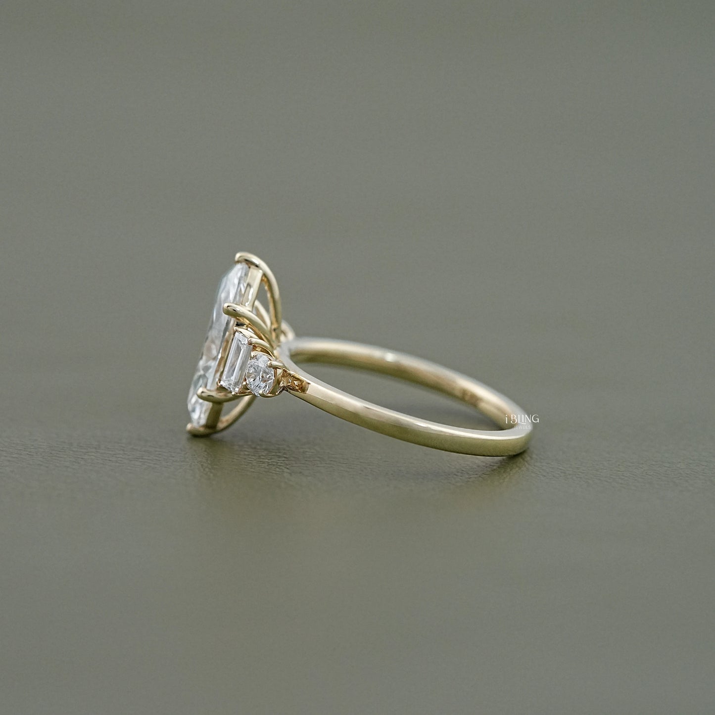 Side view of Five Stone Engagement Ring with Marquise and baguette diamond cut stones, prong set design
