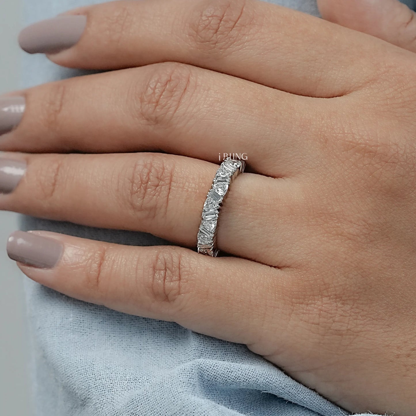 Woman wearing baguette diamond eternity band styled for daily wear