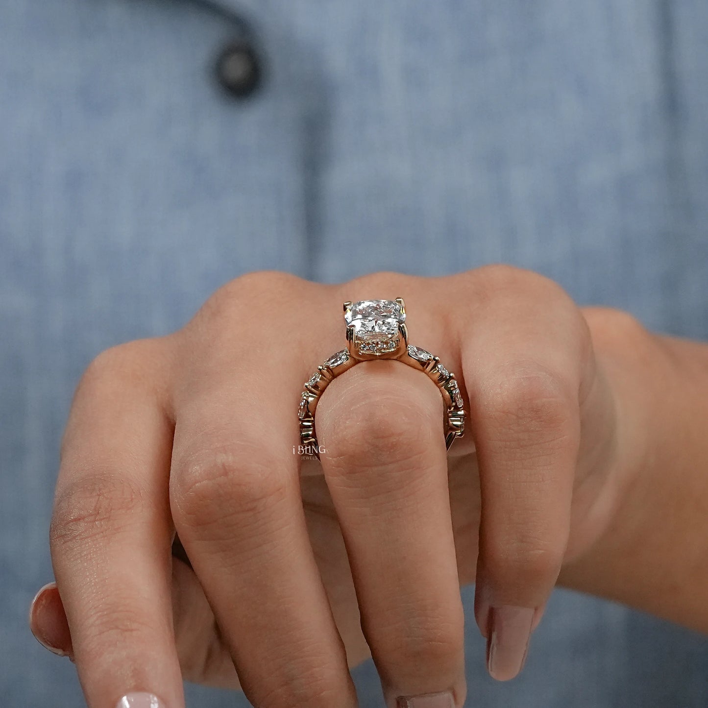 Model hand displaying a Hidden Halo Cushion Ring, beautiful design with fine diamond craftsmanship