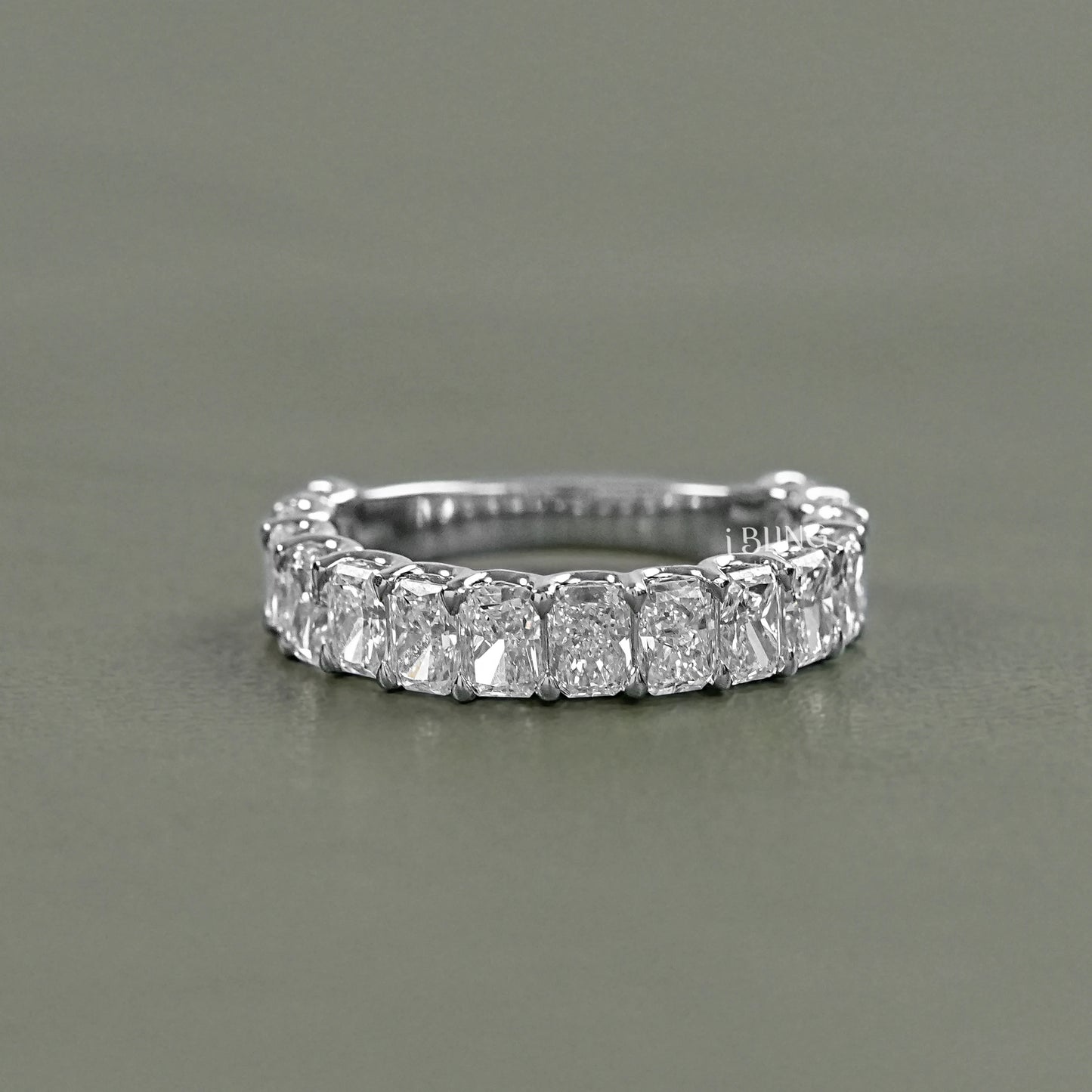 Radiant cut eternity band by iBling Jewels in a shared prong white gold settin