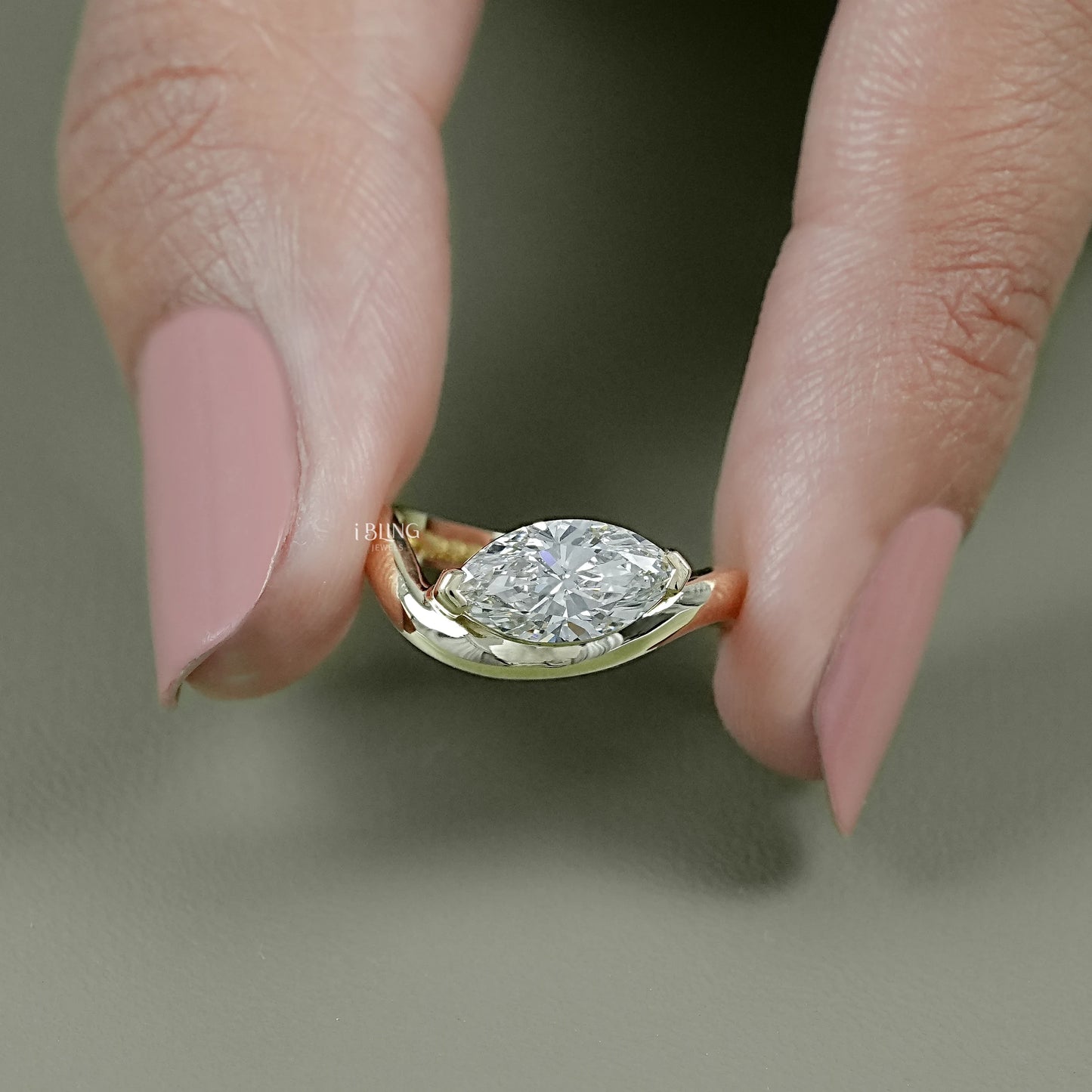 Front view east west marquise diamond ring crafted in modern gold style