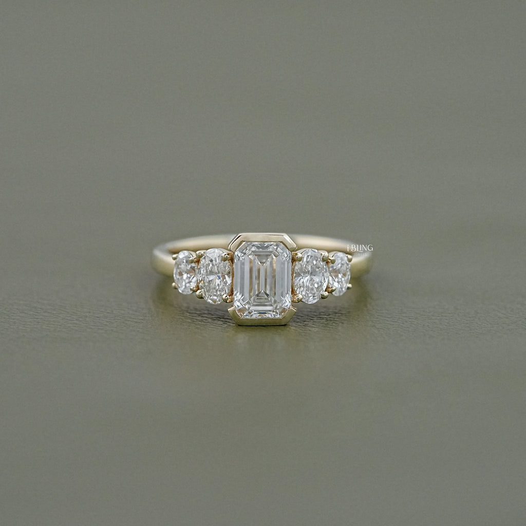 Half Bezel Set Emerald And Oval Five Stone Engagement Ring