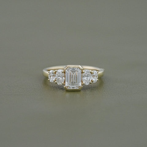 Half Bezel Set Emerald And Oval Five Stone Engagement Ring