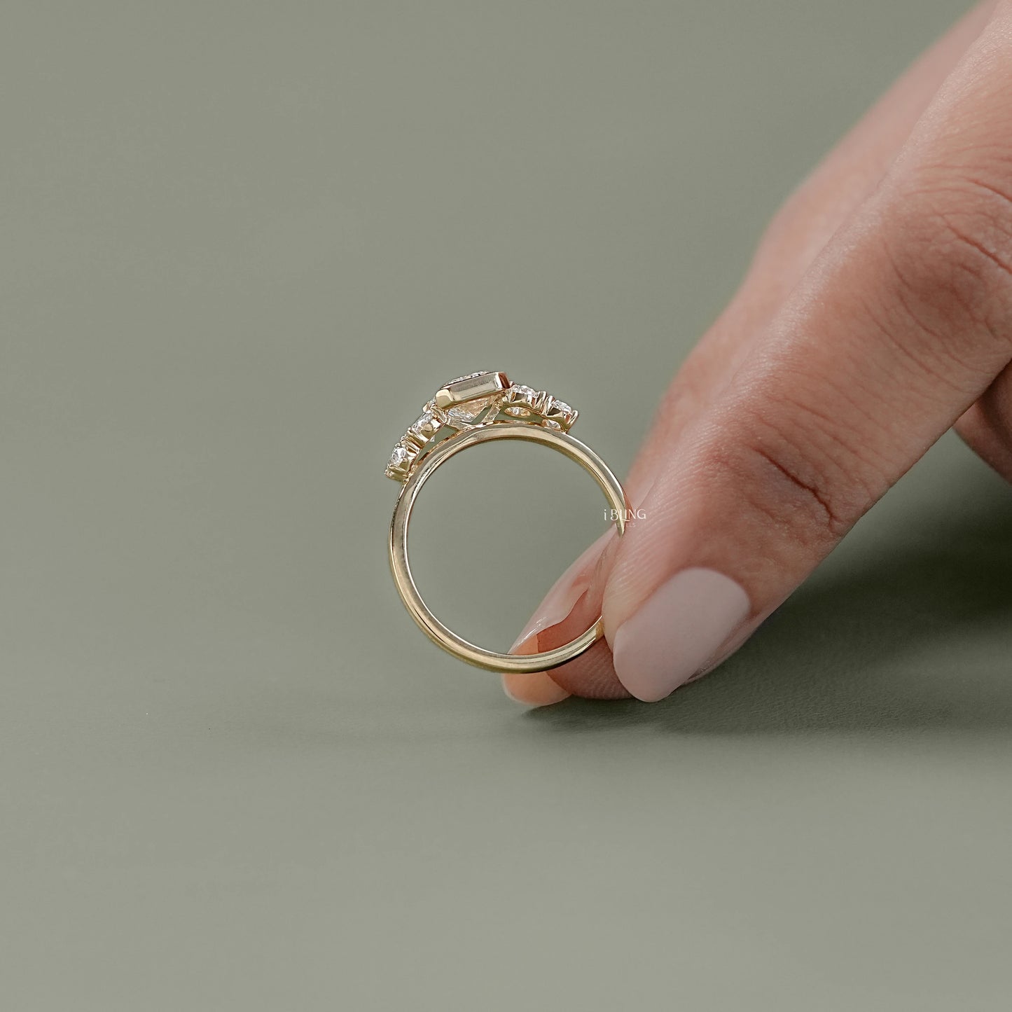 Top view of Oval Five Stone Lab Grown Diamond Engagement Ring with Emerald accents in gold