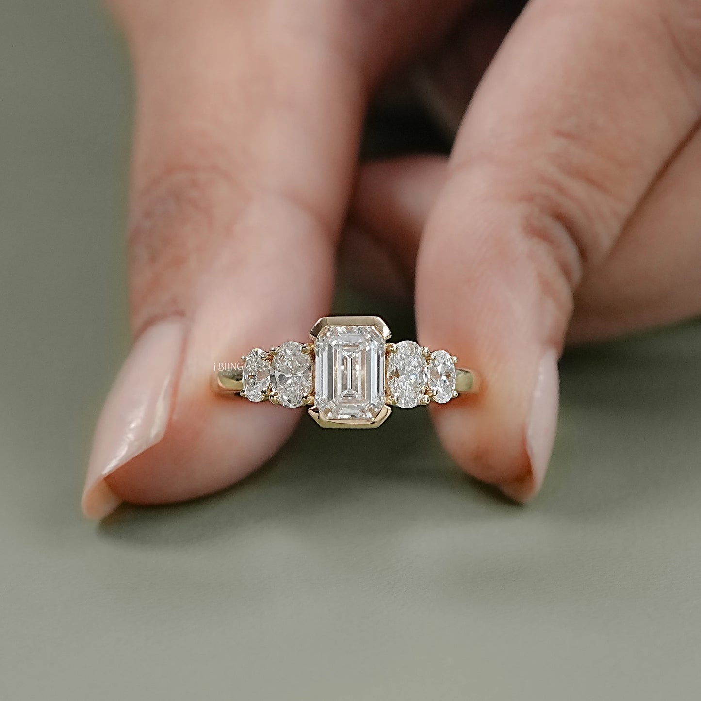 Front display of Oval Emerald Five Stone Lab Grown Diamond Engagement Ring.