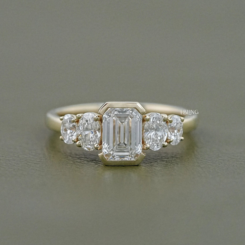 Half Bezel Set Emerald And Oval Five Stone Engagement Ring