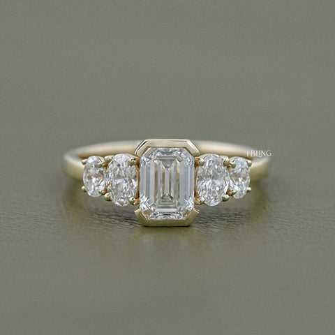 Half Bezel Set Emerald And Oval Five Stone Engagement Ring