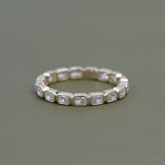 Radiant cut eternity band yellow gold by iBling Jewels in a shared prong setting.