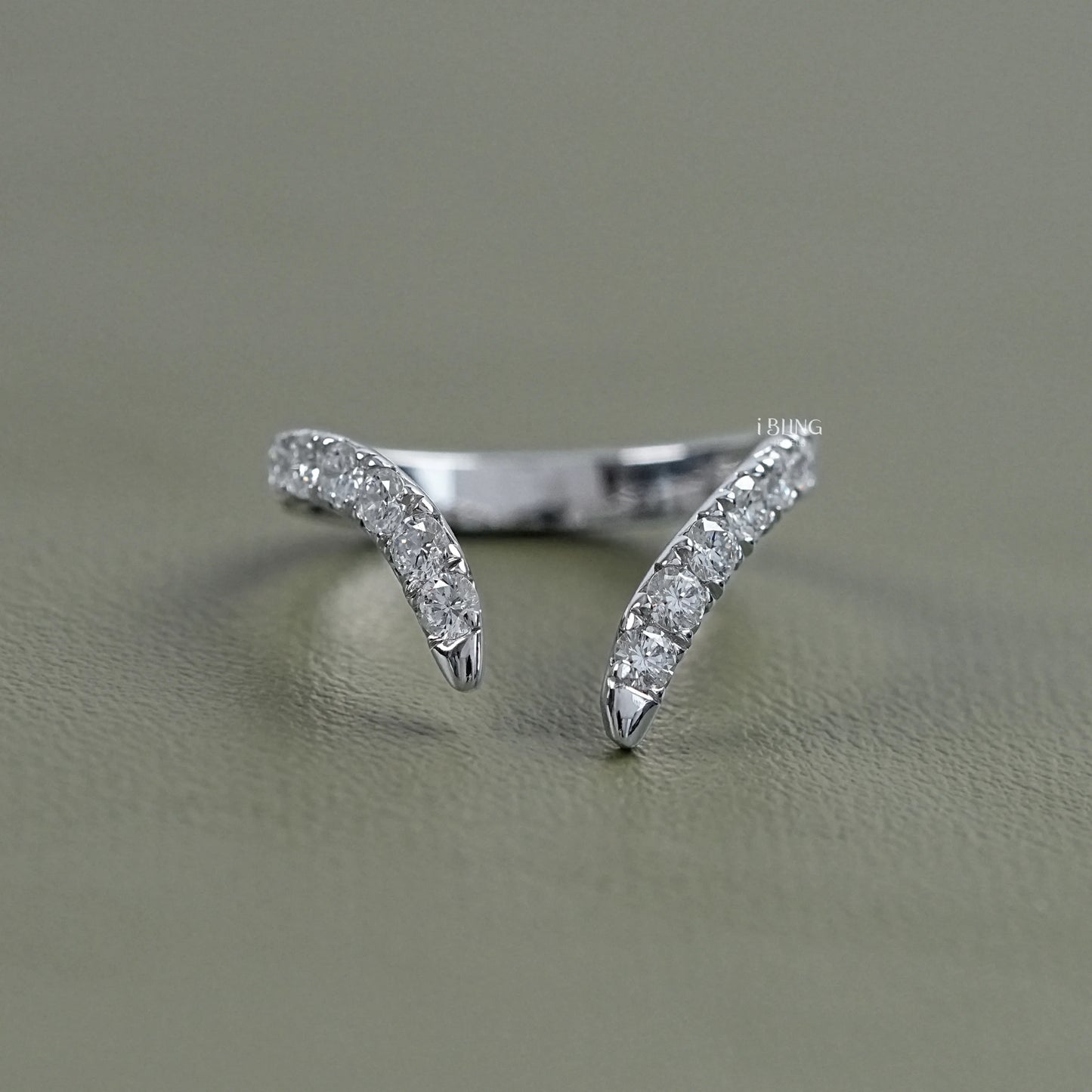 Front view of iBling Jewels v shaped wedding band with a bright row of round lab diamonds.