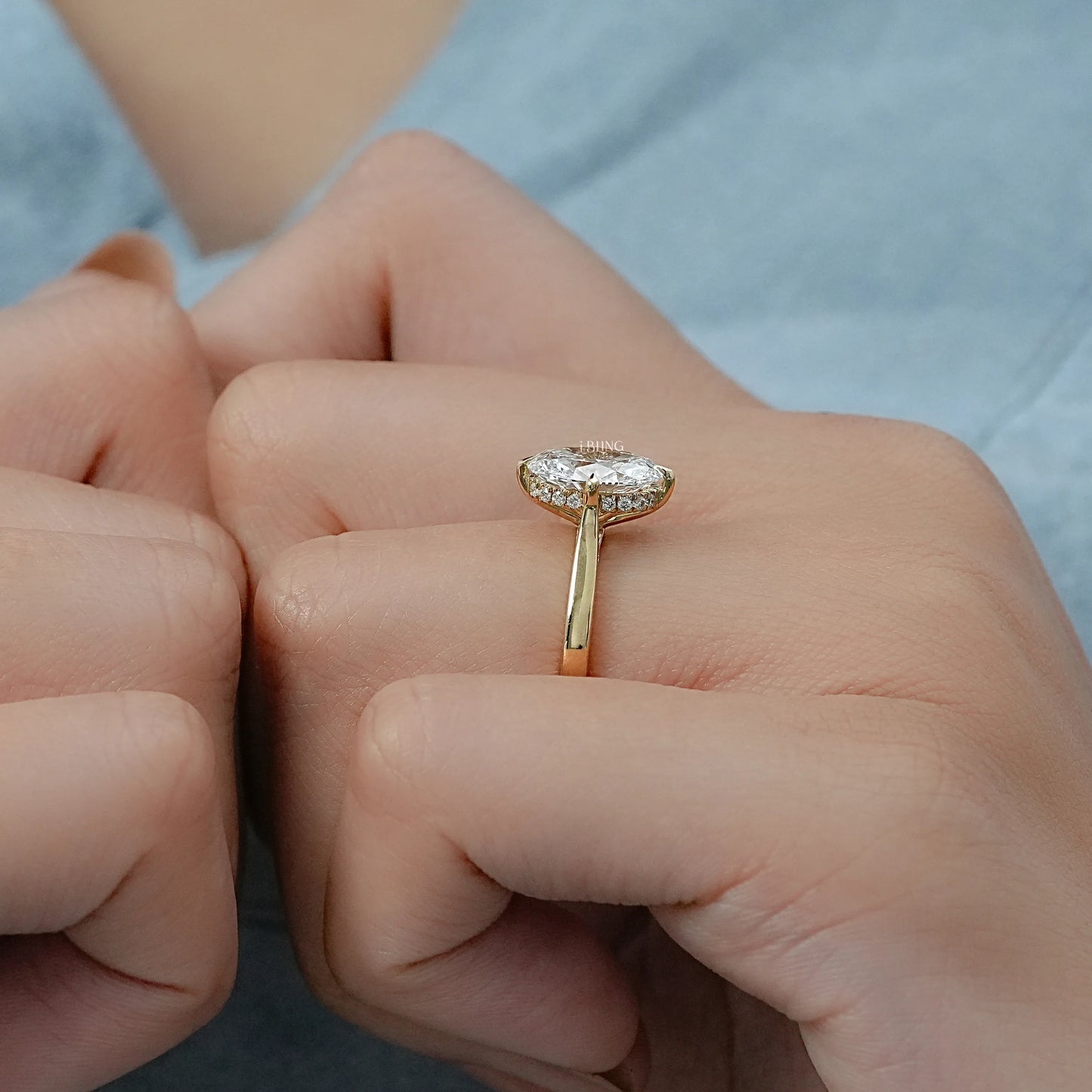 Model styling a Solitaire Diamond Engagement Ring for a high-end luxury jewelry aesthetic.