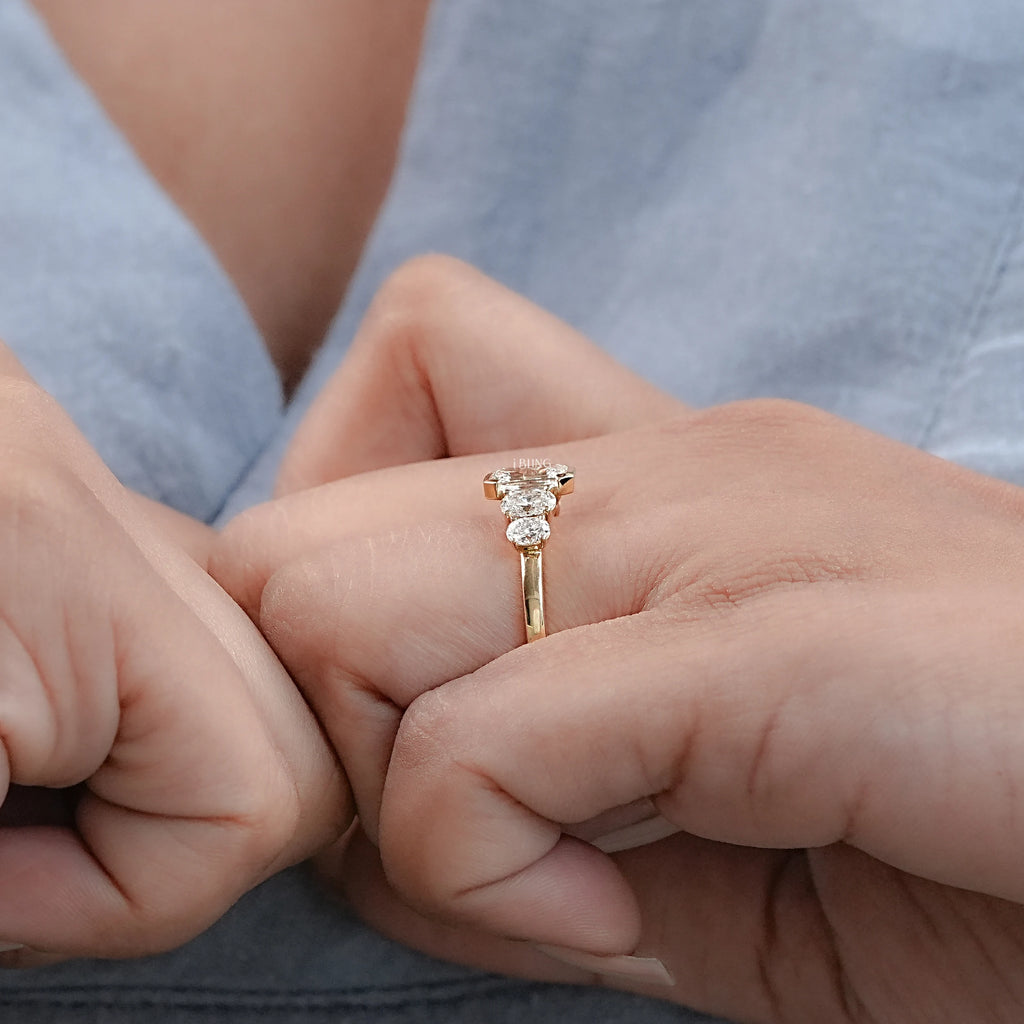 Half Bezel Set Emerald And Oval Five Stone Engagement Ring