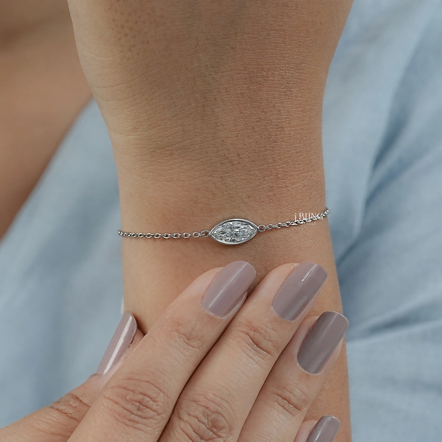 Model hand diamond solitaire bracelet for women crafted with bezel design