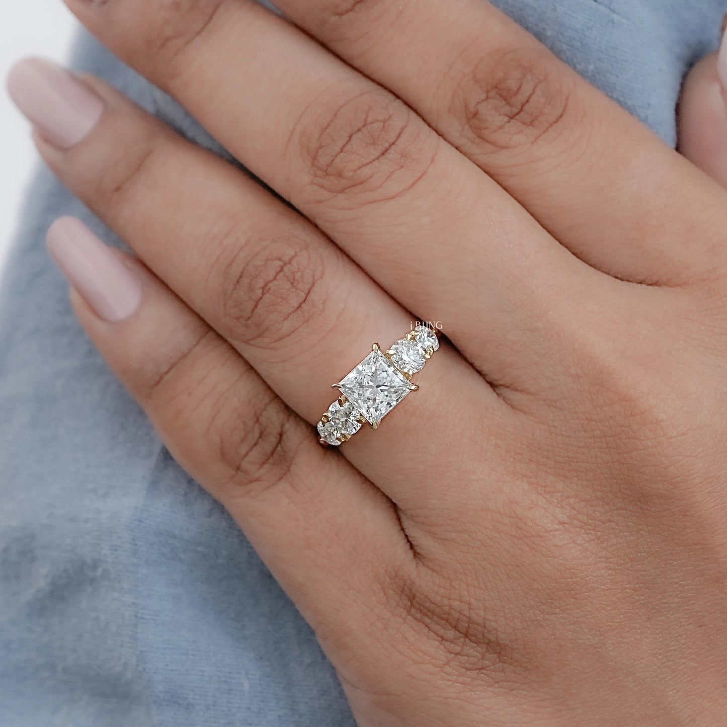 Hand showing 5 Stone Engagement rings princess cut diamond in 14K White Gold for gifting