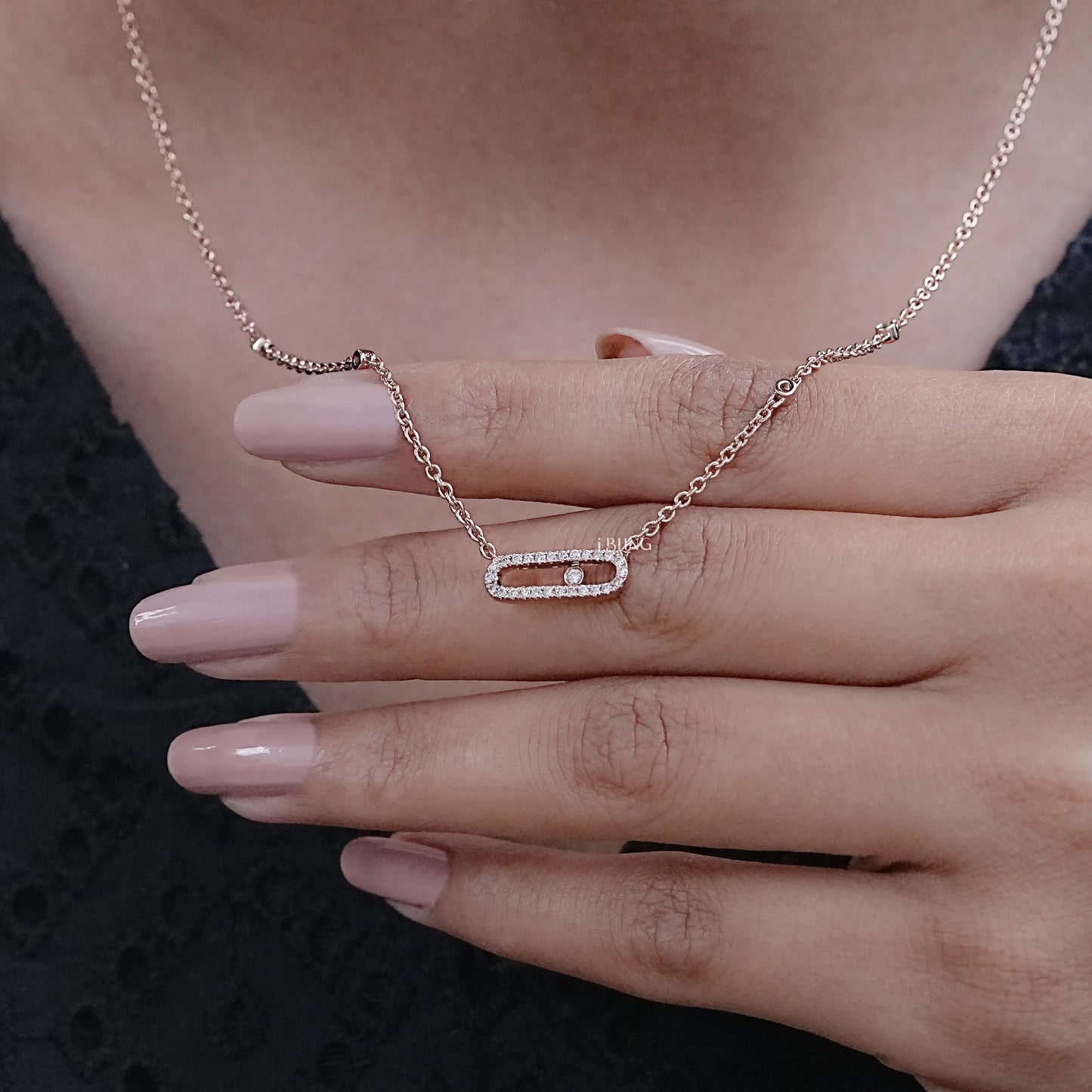 Model hand lab grown diamond pendants styled in paper clip necklace design