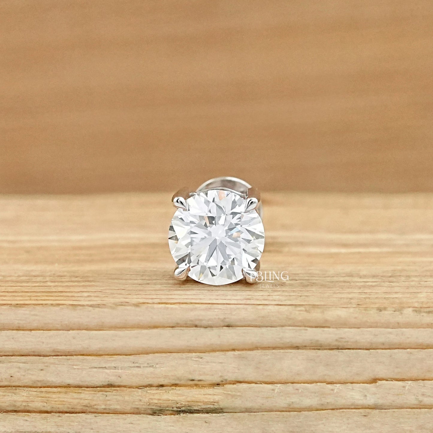 Ibling jewels lab diamond earrings for men with a classic round cut and four-prong design.