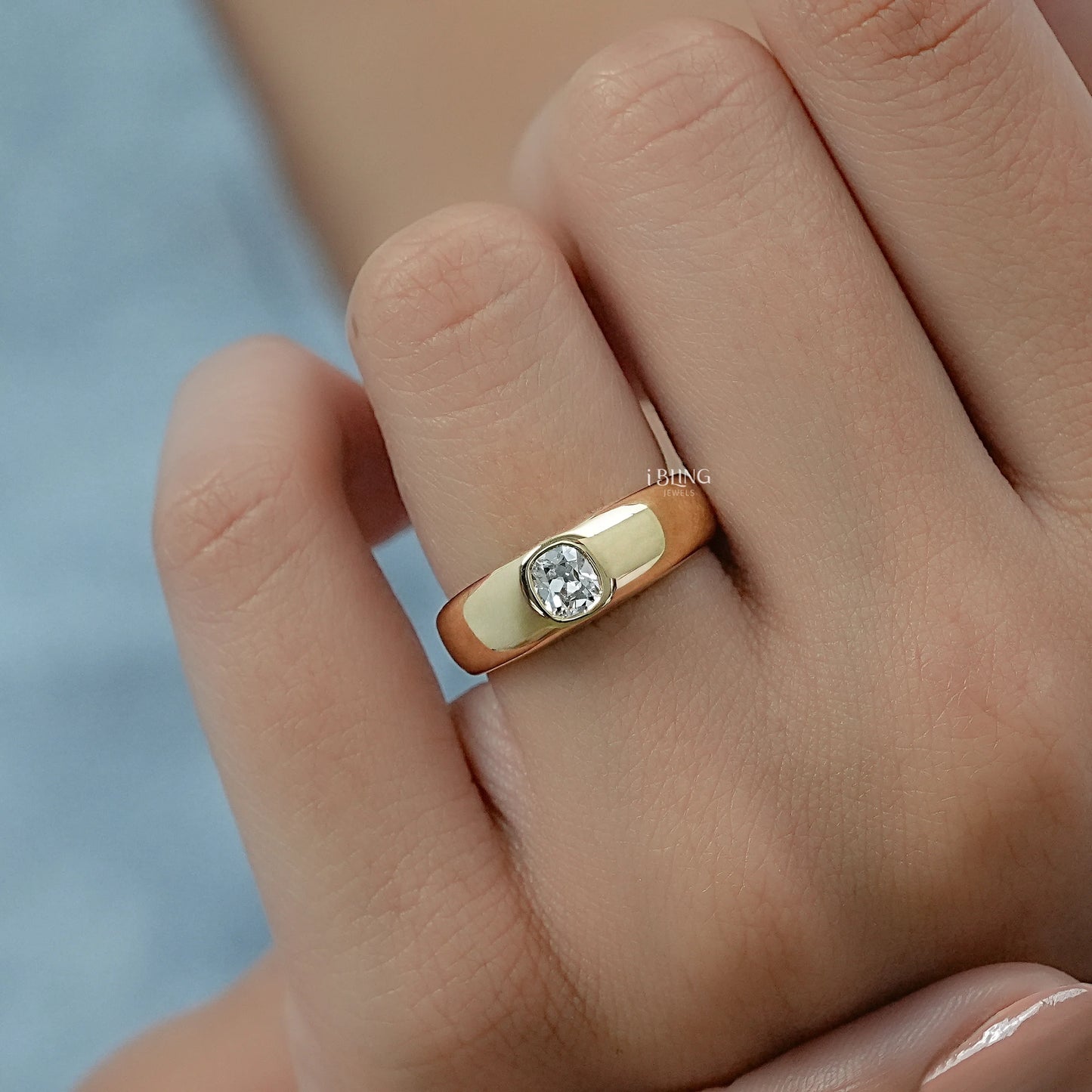 Woman hand showing a flush set diamond ring with a secure low-profile protective mount.