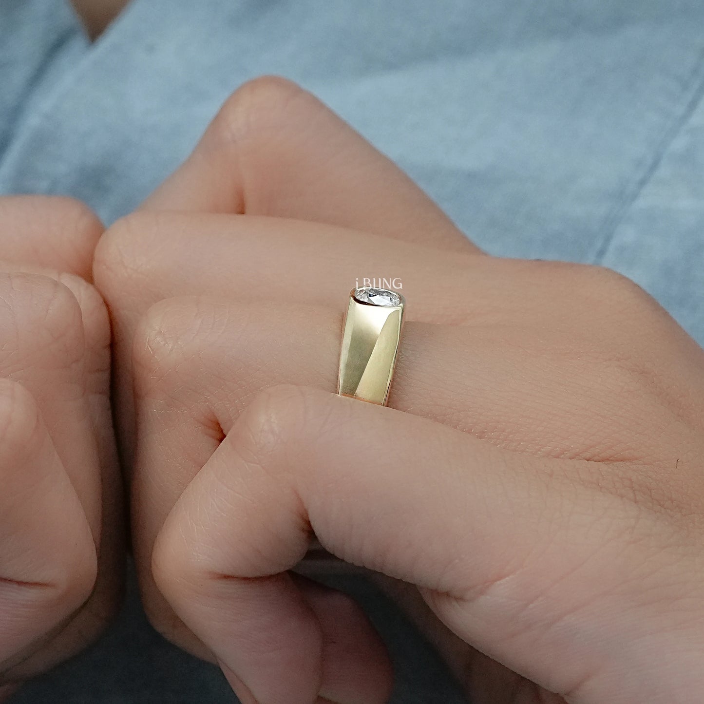 Model styling an old mine cushion cut diamond ring featuring a thick comfort-fit shank.