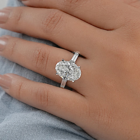 Oval And Tappered Baguette Cut Three Stone Ring