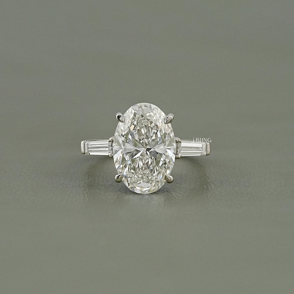 Oval And Tappered Baguette Cut Three Stone Ring
