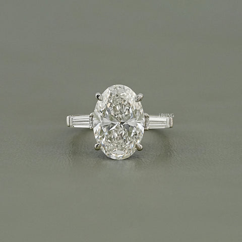 Oval And Tappered Baguette Cut Three Stone Ring