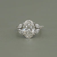 Oval Cut Diamond Solitaire Cluster Engagement Ring