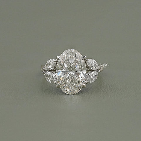 Oval Cut Diamond Solitaire Cluster Engagement Ring