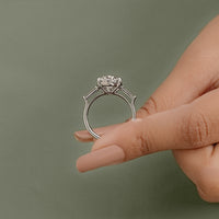 Oval And Tappered Baguette Cut Three Stone Ring