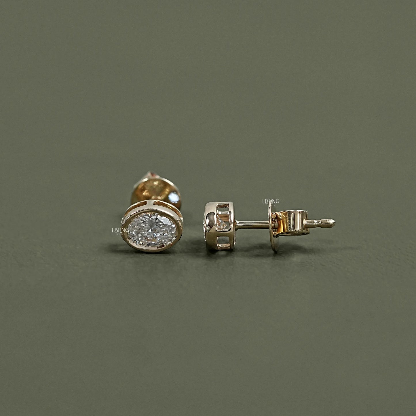 Displays Oval Cut Bezel Set Lab Grown Diamond Stud Earrings, modern jewelry for women