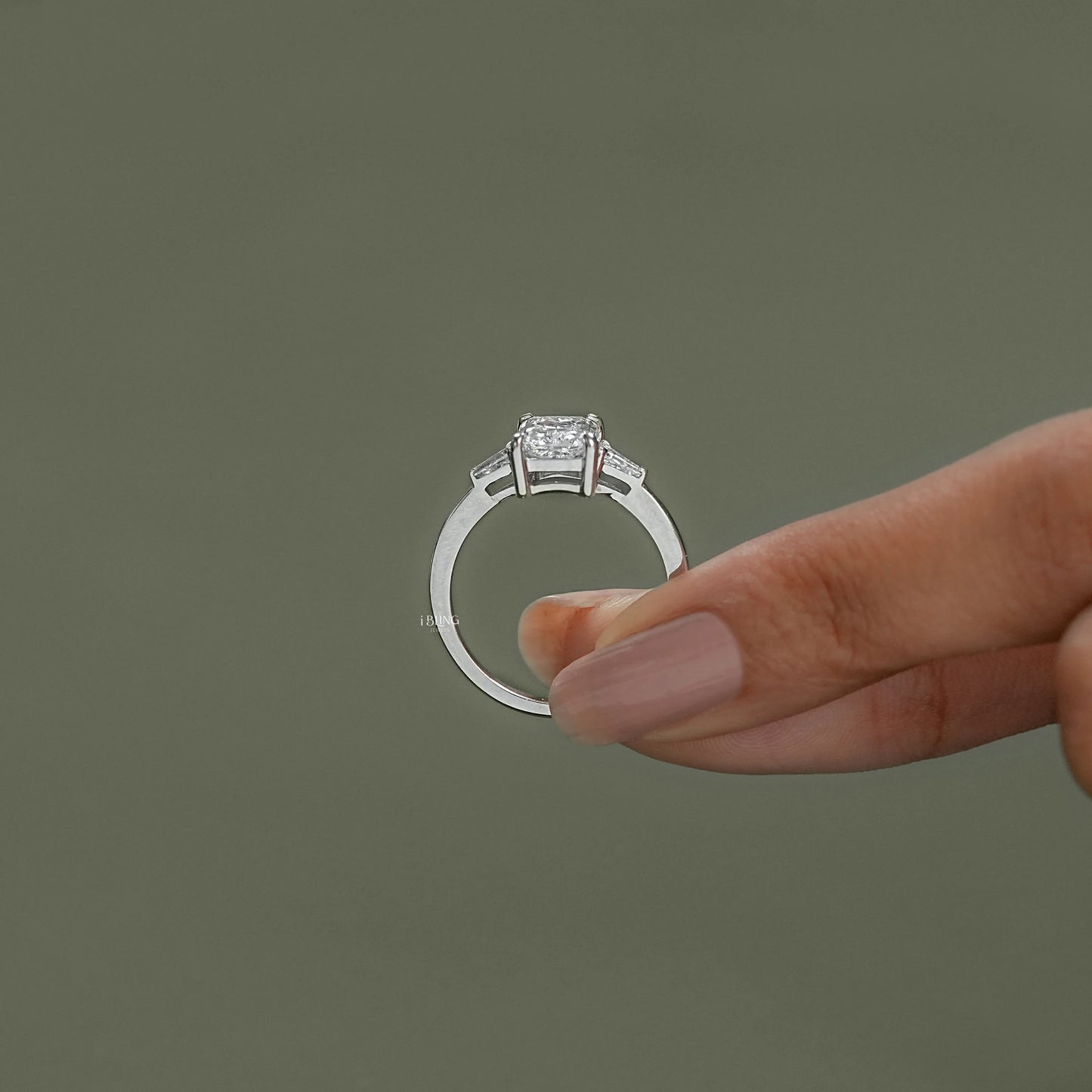 Top angle view of radiant cut diamond ring in three stone style, crafted with fine lab grown gems