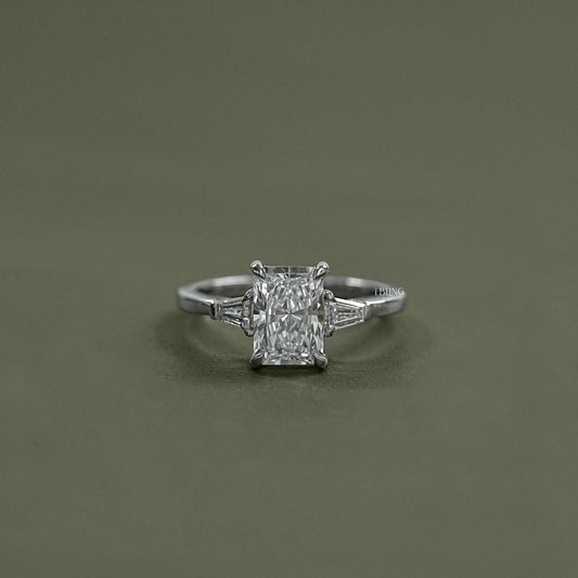 iBling Jewels showcases a Radiant Cut Three Stone Ring crafted with premium lab grown diamond center