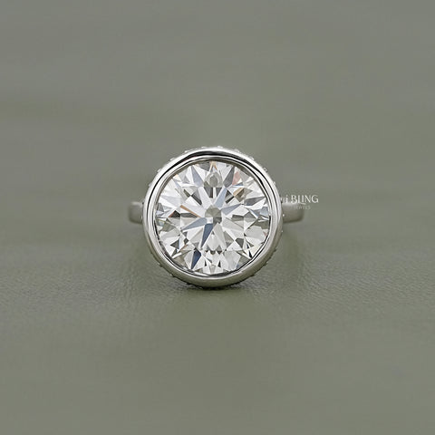 Round Cut Bezel Set Hidden Halo Engagement Ring