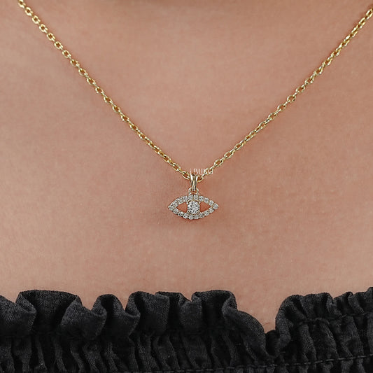 Woman neck evil eye pendant styled with round lab diamond center