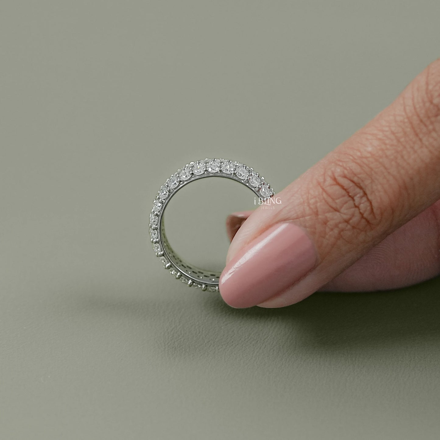 Top view full diamond eternity band featuring oval lab diamond layout
