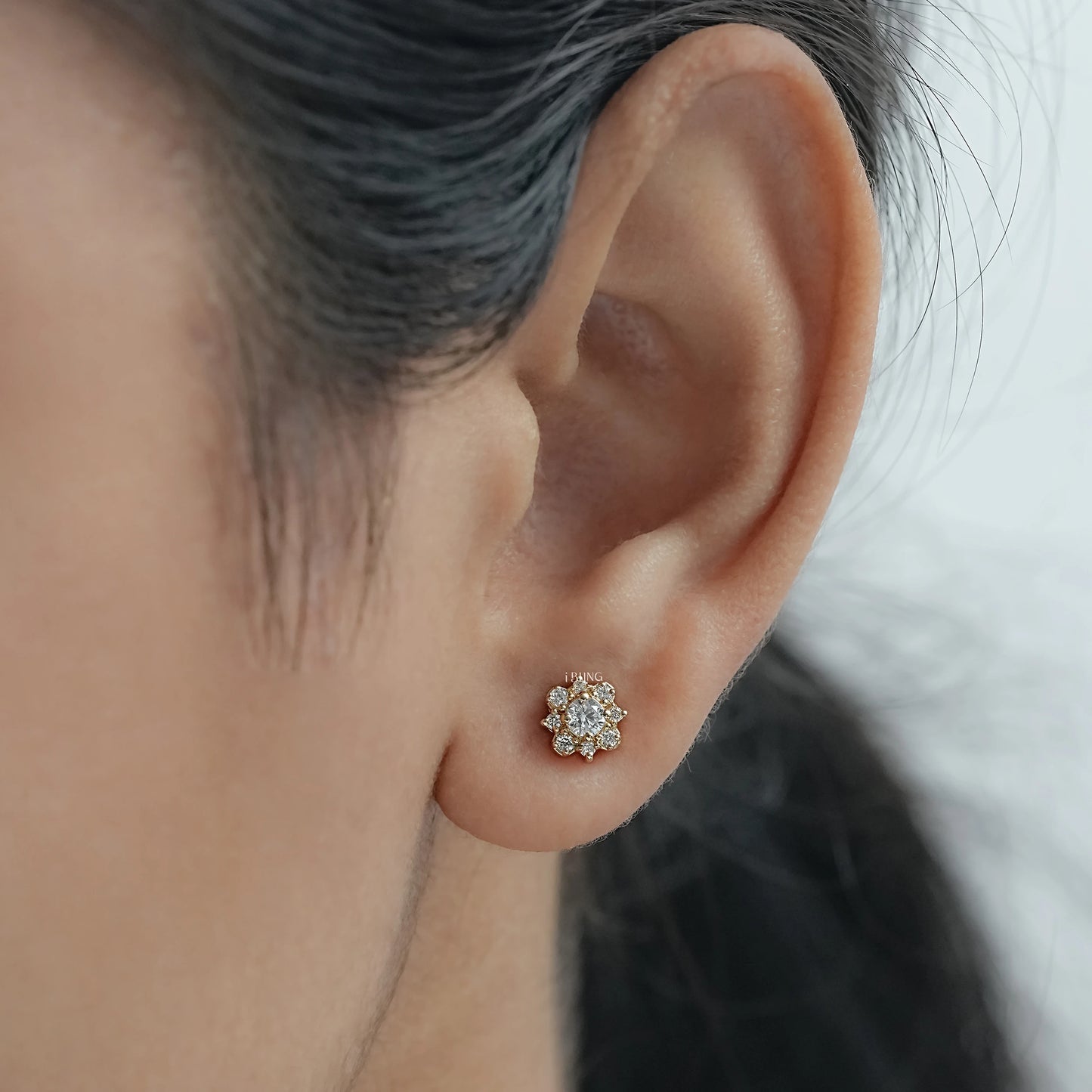 Top view round diamond stud earrings for women crafted in floral halo design